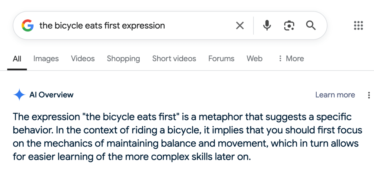 The expression "the bicycle eats first" is a metaphor that suggests a specific behavior. In the context of riding a bicycle, it implies that you should first focus on the mechanics of maintaining balance and movement, which in turn allows for easier learning of the more complex skills later on.
